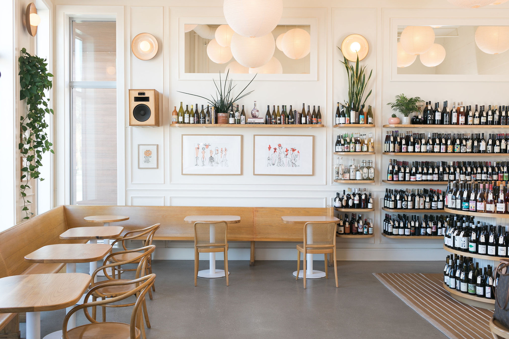 An empty wine shop with tables and chairs