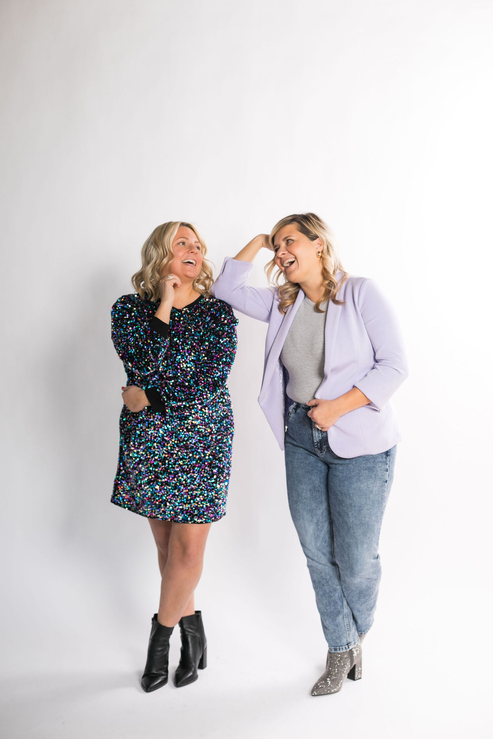 Chelsea and Kayla standing next to each other laughing